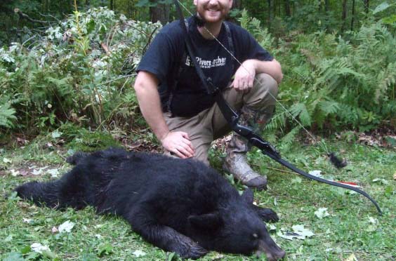 Johnathan Karch and his black bear harvest.