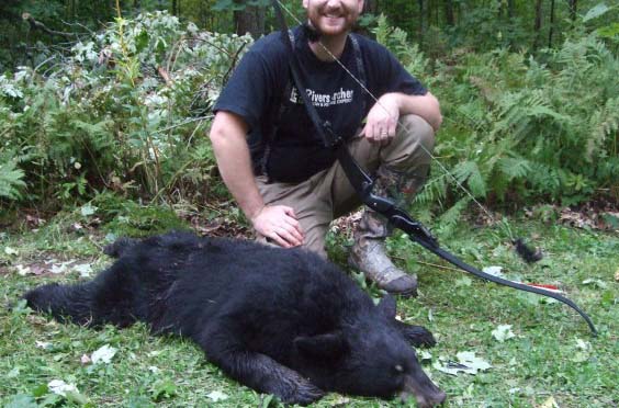 Johnathan Karch and his black bear harvest.