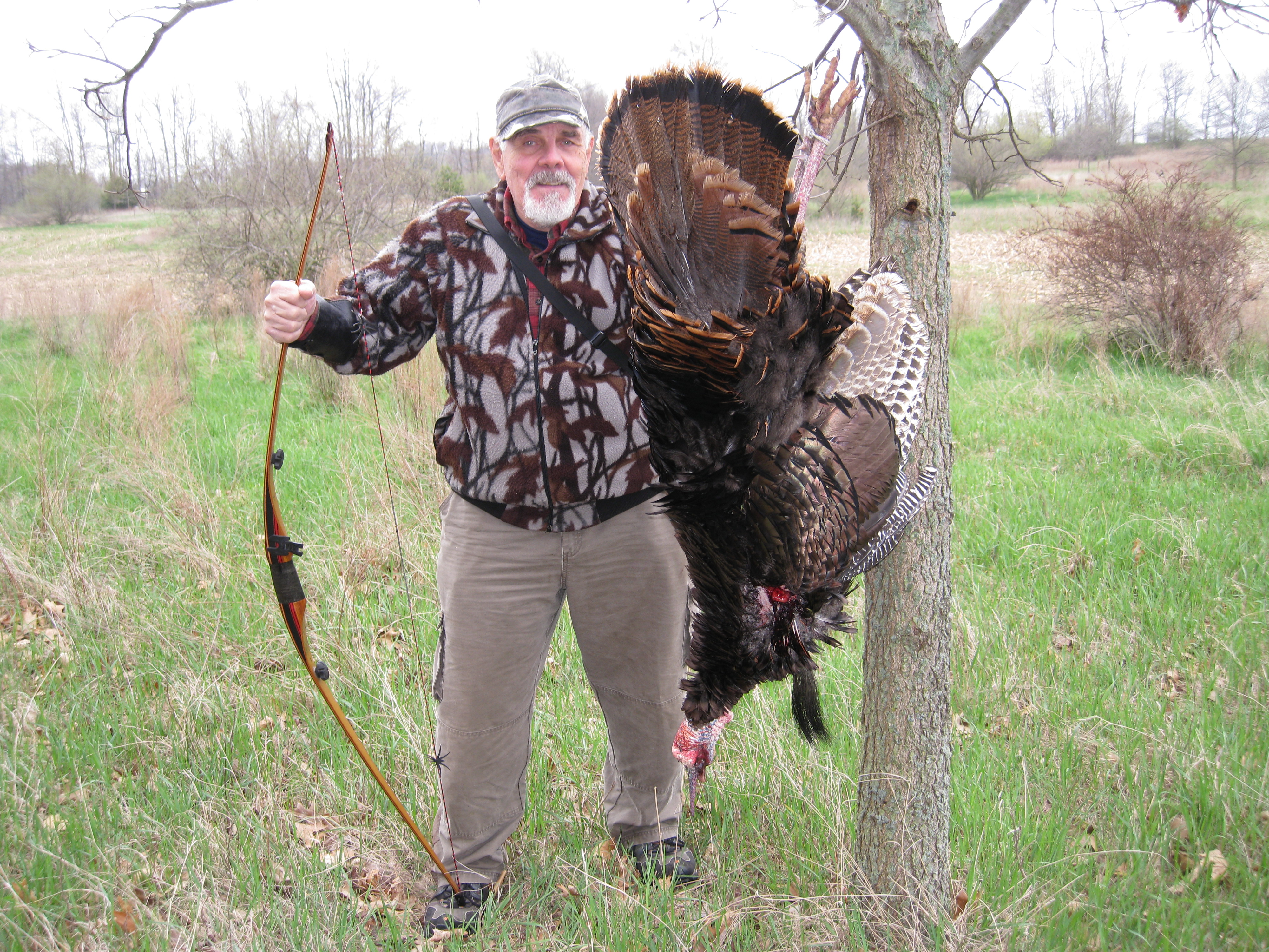 Denny Sturgis St with turkey taken with a recurve bow