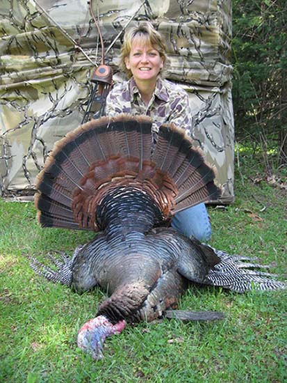 Marie Sturgis with 1st turkey while turkey hunting the 'sweet spot' blind set-up