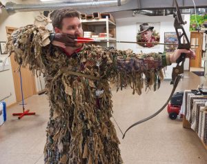 Using the ghillie suit carry strap for keeping the chest area tight to the body