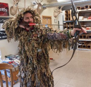 Practive shooting your bow and arrow with your ghillie suit on