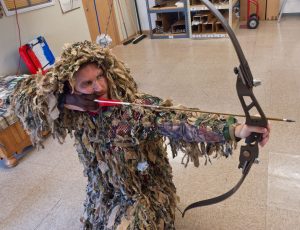 Practice different shooting stances while wearing your ghillie suit
