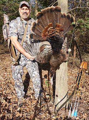 Denny Sturgis Jr with jake turkey taken with his bow with a clicker installed