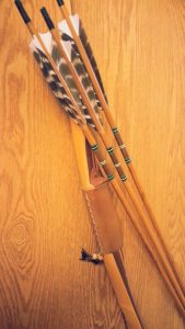 Primitive bamboo backed bow with wood arrows