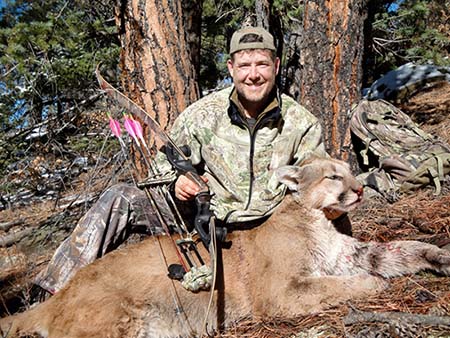 Fred Eichler enjoys the challenge and efficiency of bowhunting with traditional gear. Here he is with a mountain lion he shot with his trusty recurve bow.