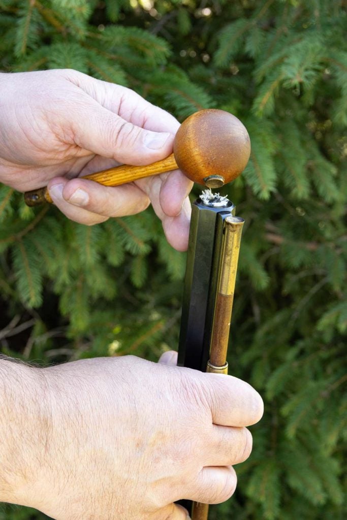 Use a ball starter to gently push the projectile into the barrel.