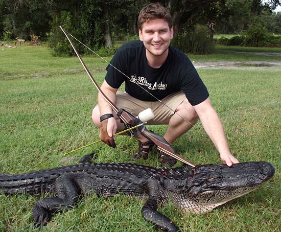Johnathan Karch with his first alligator
