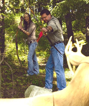 3Rivers Archery Owner Dale Karch gets in some target practice with 3Rivers VP of Operations, Teresa Williams.