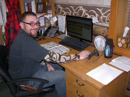 Dave working at his desk at 3Rivers Archery