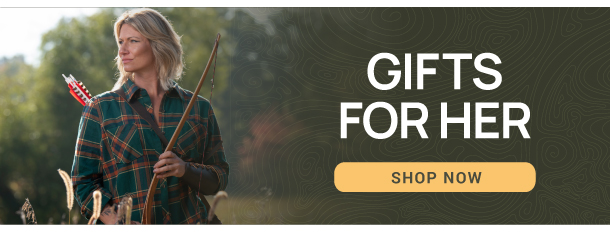 Santa Clause hanging archery stockings with gifts for good little boys and girls